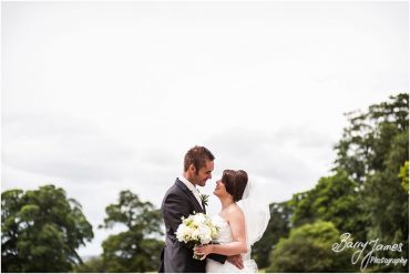 Timeless elegant portraits on the front lawns at Sandon Hall in Staffordshire by Stafford Wedding Photographer Barry James