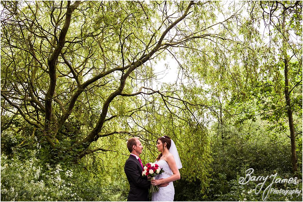 Creative contemporary photographs of the bride and groom around the beautiful gardens at Calderfields in Walsall by Walsall Wedding Photographers Barry James
