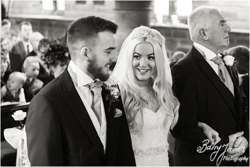 Candid photographs capturing the arrival of the bride at St Peters Little Aston in Sutton Coldfield by Sutton Coldfield Wedding Photographer Barry James