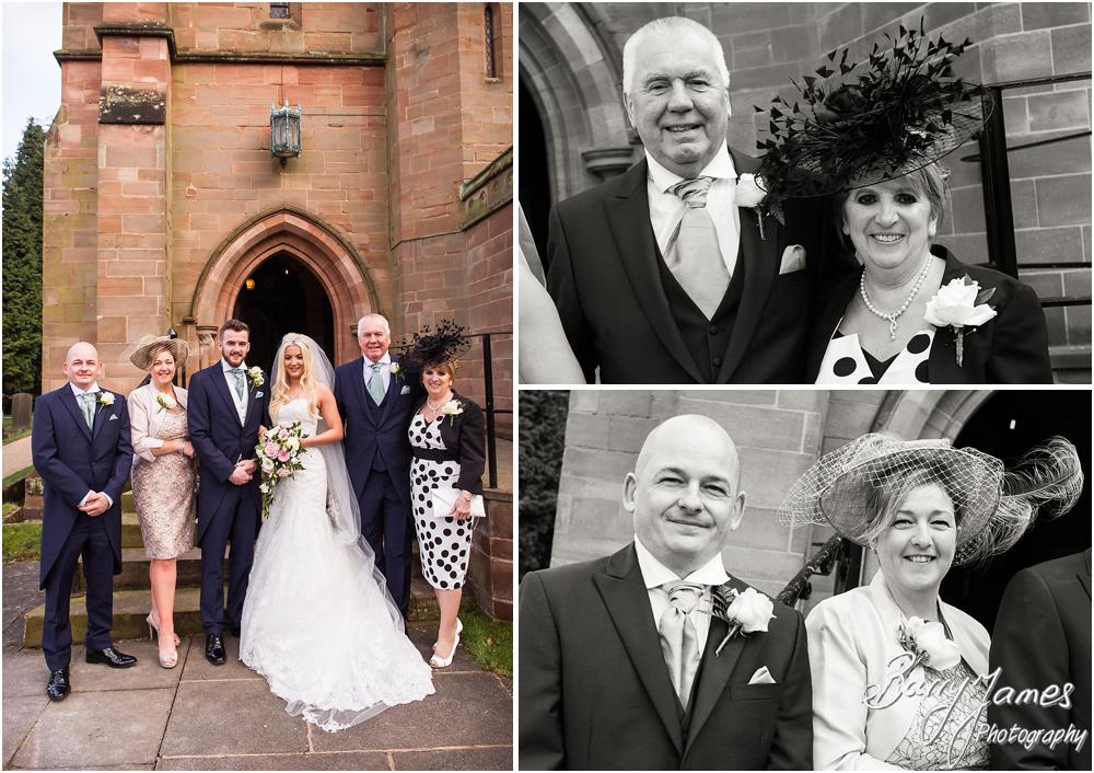 Contemporary family portraits on the steps at St Peters Little Aston in Sutton Coldfield by Sutton Coldfield Wedding Photographer Barry James