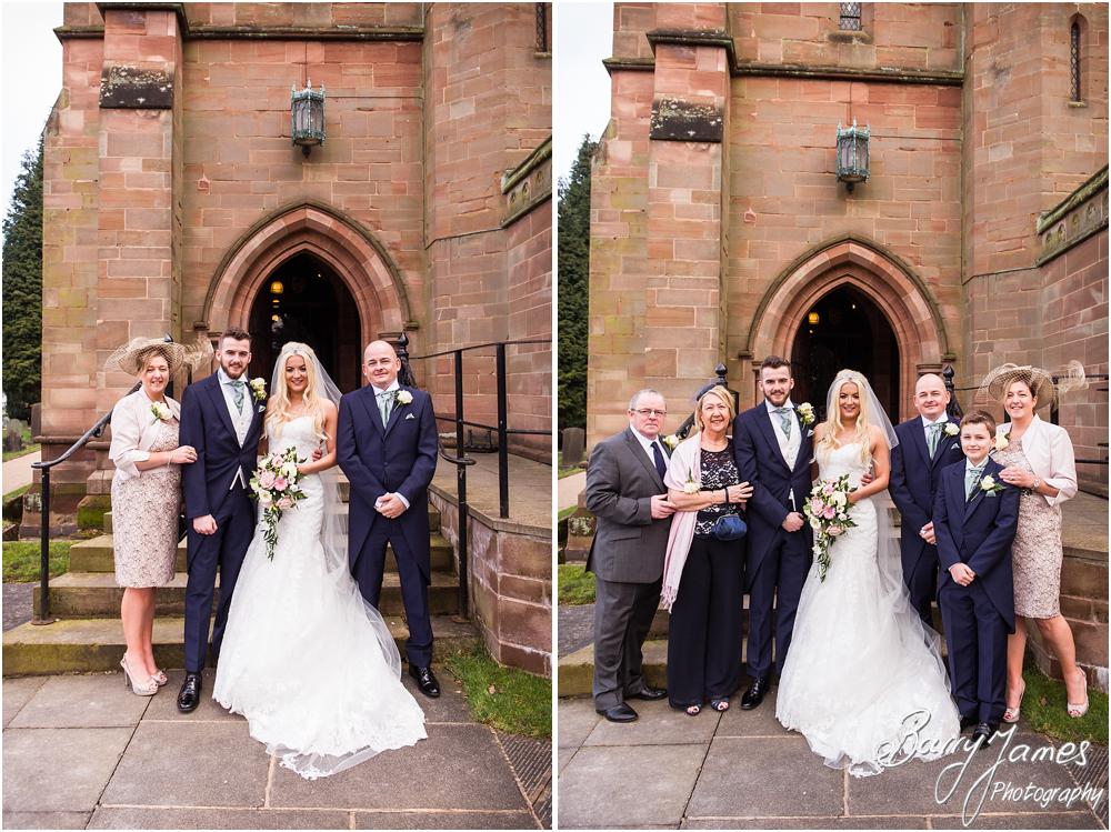 Contemporary family portraits on the steps at St Peters Little Aston in Sutton Coldfield by Sutton Coldfield Wedding Photographer Barry James