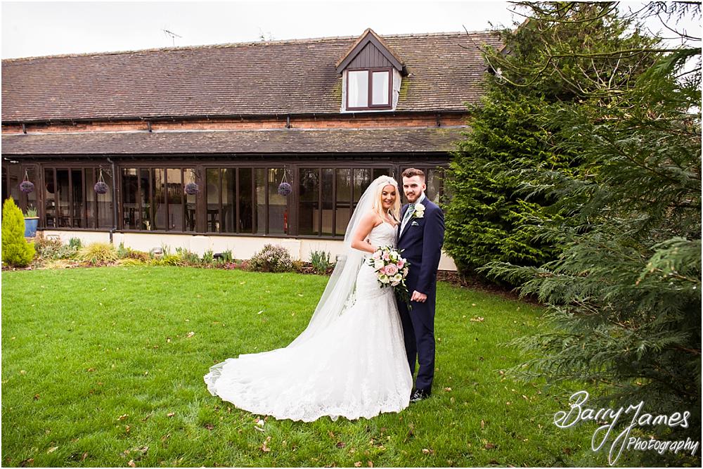 Creative and relaxed portraits of the bride and groom around the beautiful gardens at Oak Farm Hotel in Cannock by CannockWedding Photographer Barry James