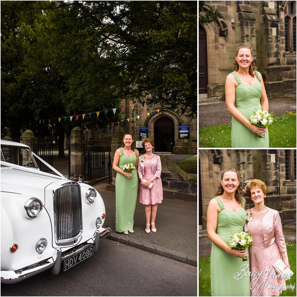 Photographing the arrival of the Bridesmaids looking stunning in their dresses from White Rose at St Augustines in Rugeley by Rugeley Wedding Photographers Barry James