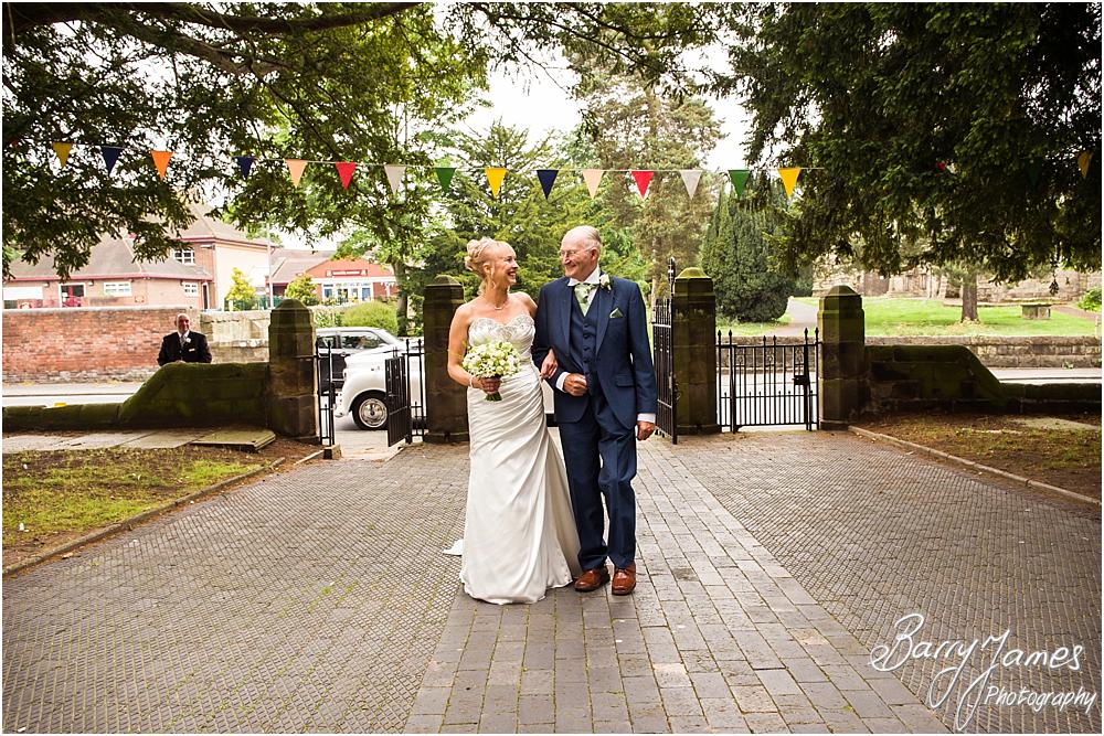 Candid photographs telling the story of the Brides arrival at St Augustines in Rugeley by Rugeley Wedding Photographers Barry James