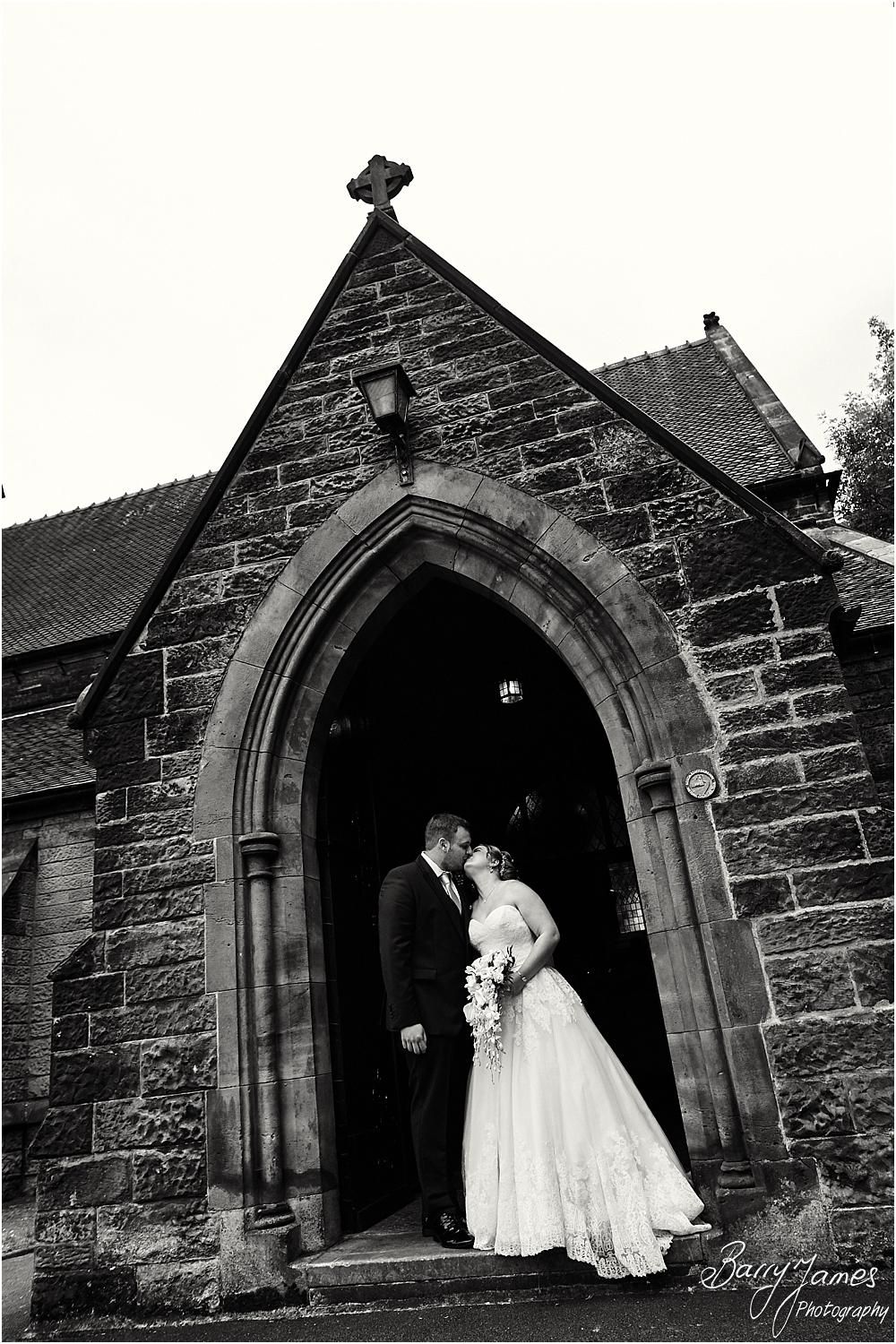 Creative portraits of the newly married couple of the doorway at St Marks Church in Great Wyrley by Cannock Wedding Photographer Barry James