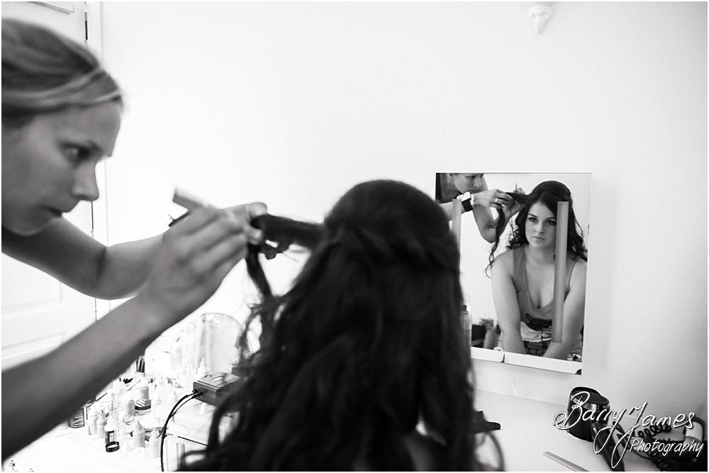Candid photographs of the bridal hair and makeup on the wedding morning at Hoar Cross Hall in Staffordshire by Stafford Wedding Photographer Barry James