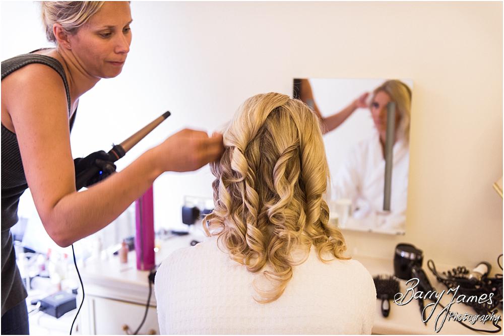 Candid photographs of the bridal hair and makeup on the wedding morning at Hoar Cross Hall in Staffordshire by Stafford Wedding Photographer Barry James