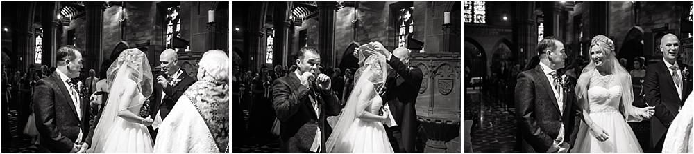 Candid photos showing the emotion and excitement at the bridal procession at Holy Angels Church at Hoar Cross Hall in Staffordshire by Stafford Wedding Photographer Barry James