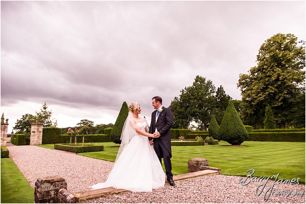Creative portraits of the bride and groom utilising the stunning setting of Hoar Cross Hall in Staffordshire by Stafford Wedding Photographer Barry James