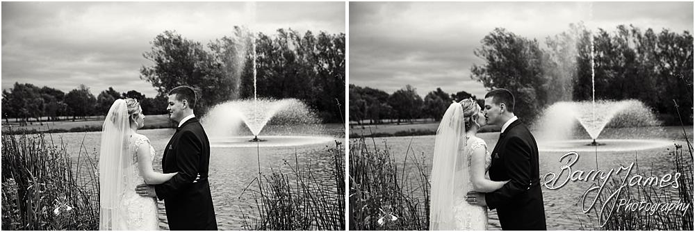Beautiful photographs of the bride and groom in the stunning lakeside grounds at Calderfields Walsall by Walsall Wedding Photographer Barry James