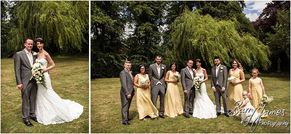 Relaxed family groups in the church gardens at All Saints Church in Bloxwich by Walsall Wedding Photographer Barry James