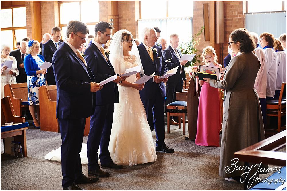 Unobtrusive storytelling photographs of the beautiful wedding ceremony at Brownhills Methodist Church in Walsall by Walsall Wedding Photographer Barry James