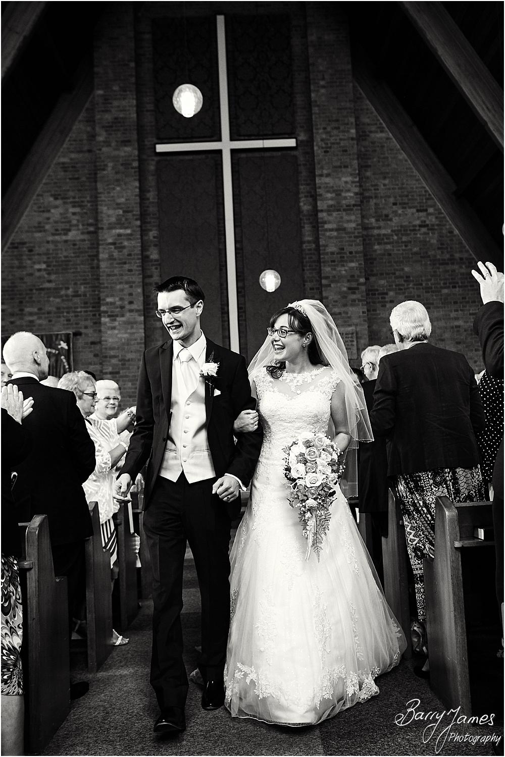 Candid photographs of the beautiful recessional for the newly married Mr & Mrs Booth at Brownhills Methodist Church in Walsall by Walsall Wedding Photographer Barry James