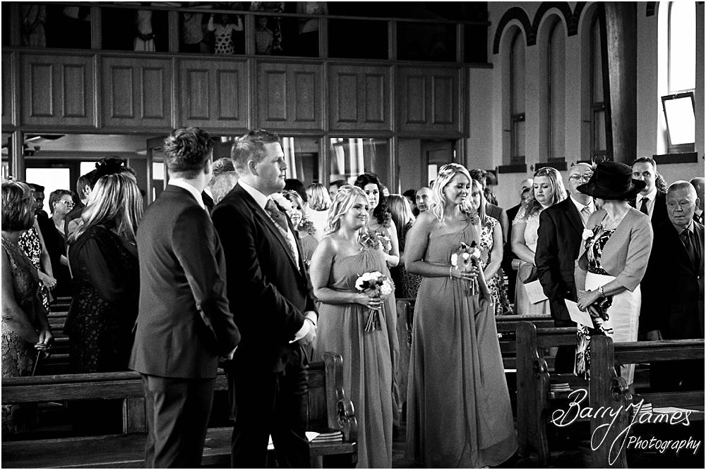 Unobtrusive storytelling photographs of the wedding ceremony at St Annes at Streetly by Wedding Photographer Barry James