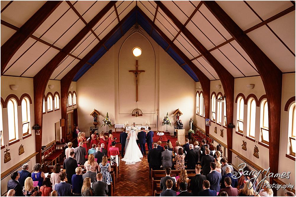 Unobtrusive storytelling photographs of the wedding ceremony at St Annes at Streetly by Wedding Photographer Barry James