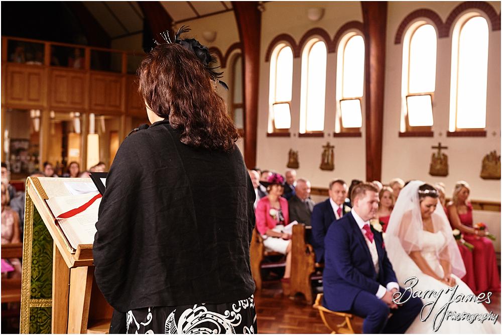 Unobtrusive storytelling photographs of the wedding ceremony at St Annes at Streetly by Wedding Photographer Barry James