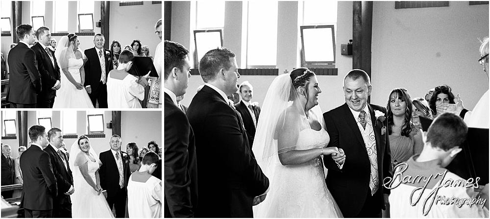 Unobtrusive storytelling photographs of the wedding ceremony at St Annes at Streetly by Wedding Photographer Barry James
