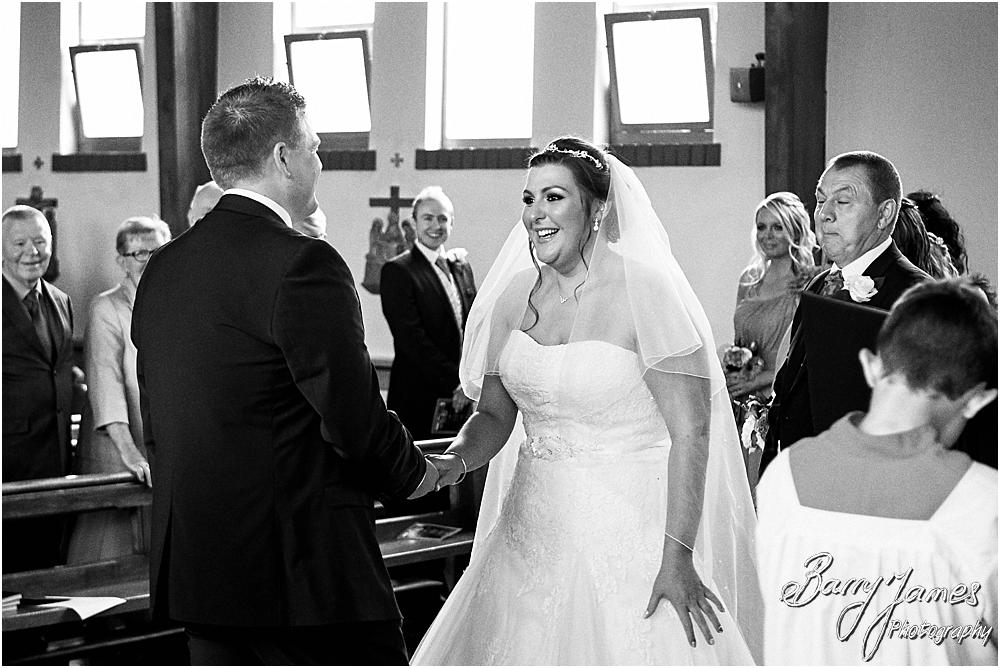 Unobtrusive storytelling photographs of the wedding ceremony at St Annes at Streetly by Wedding Photographer Barry James
