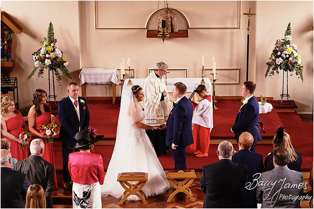 Unobtrusive storytelling photographs of the wedding ceremony at St Annes at Streetly by Wedding Photographer Barry James