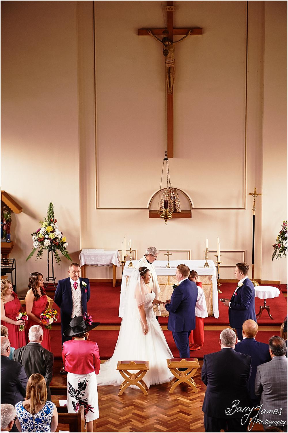 Unobtrusive storytelling photographs of the wedding ceremony at St Annes at Streetly by Wedding Photographer Barry James