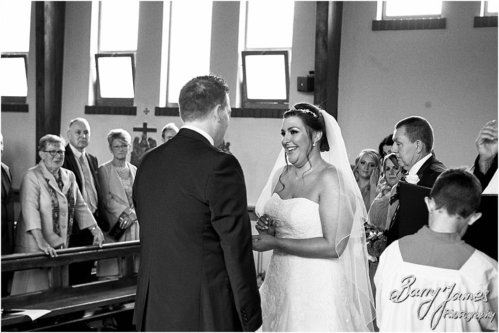 Unobtrusive storytelling photographs of the wedding ceremony at St Annes at Streetly by Wedding Photographer Barry James