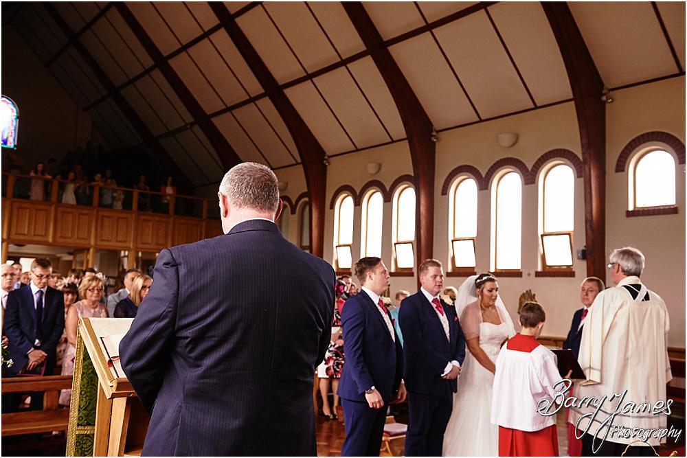 Unobtrusive storytelling photographs of the wedding ceremony at St Annes at Streetly by Wedding Photographer Barry James