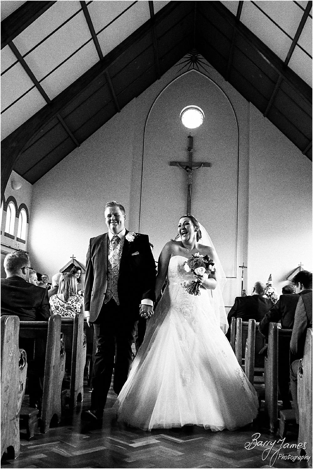 Unobtrusive storytelling photographs of the wedding ceremony at St Annes at Streetly by Wedding Photographer Barry James