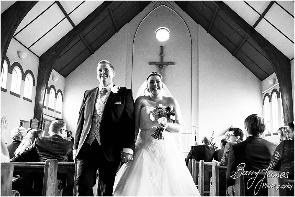 Unobtrusive storytelling photographs of the wedding ceremony at St Annes at Streetly by Wedding Photographer Barry James