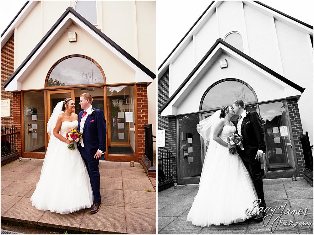 Family photographs on the church door at St Annes at Streetly by Wedding Photographer Barry James