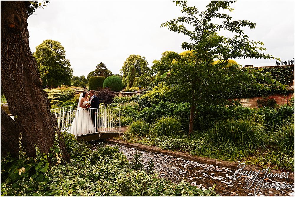 Creative natural wedding portraits around the stunning grounds and gardens at Chateau Impney at Droitwich by Wedding Photographer Barry James