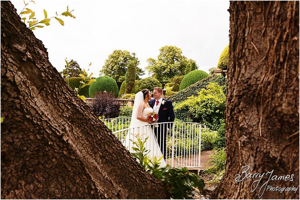 Creative natural wedding portraits around the stunning grounds and gardens at Chateau Impney at Droitwich by Wedding Photographer Barry James