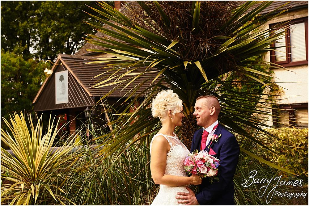 Creative relaxed portraits in the stunning front gardens at Oak Farm Hotel in Cannock by Cannock Wedding Photographer Barry James