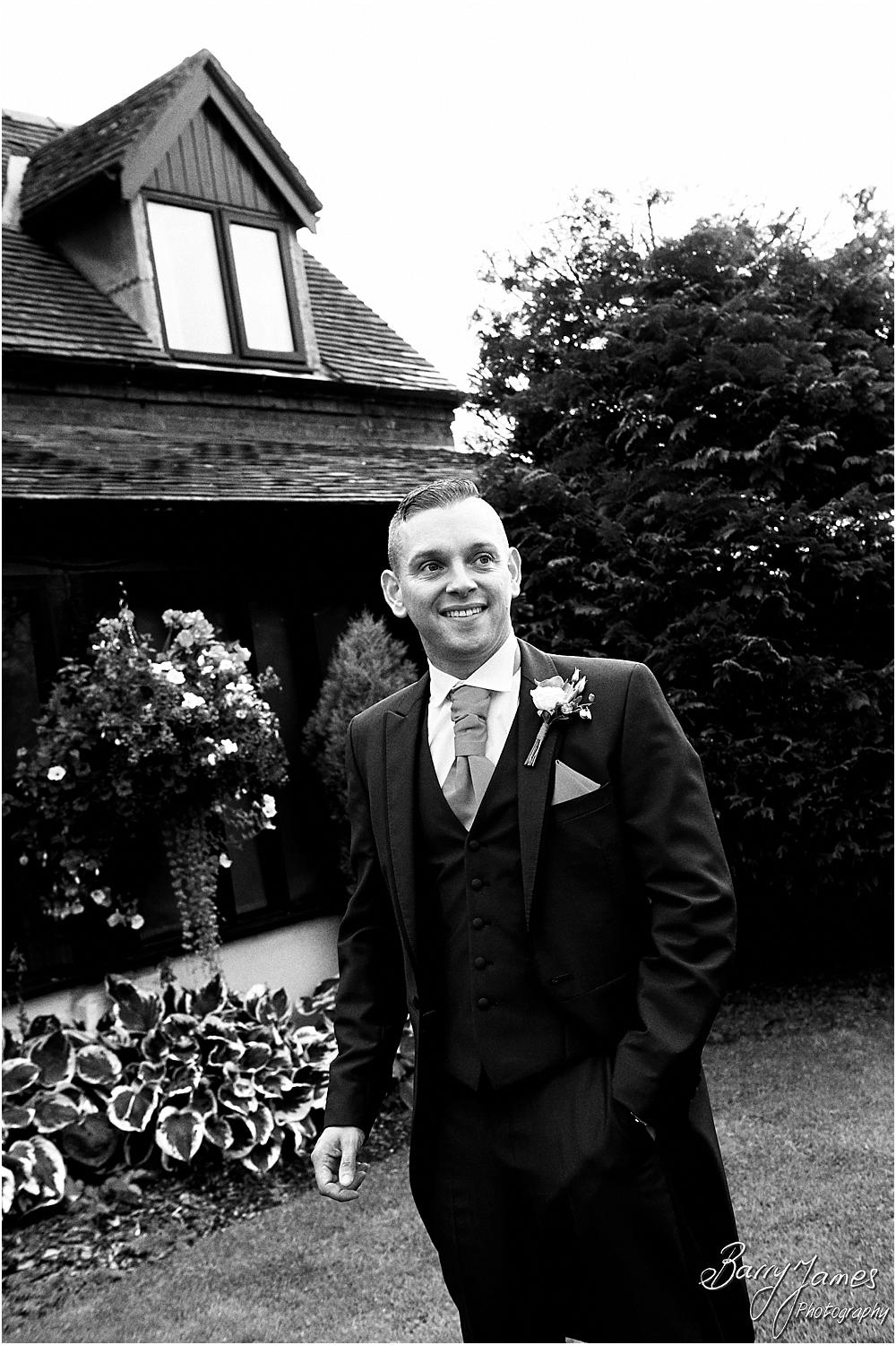 Relaxed photographs of the groomsmen in their fabulous suits from Kevin Paul at Oak Farm Hotel in Cannock by Stafford Wedding Photographer Barry James
