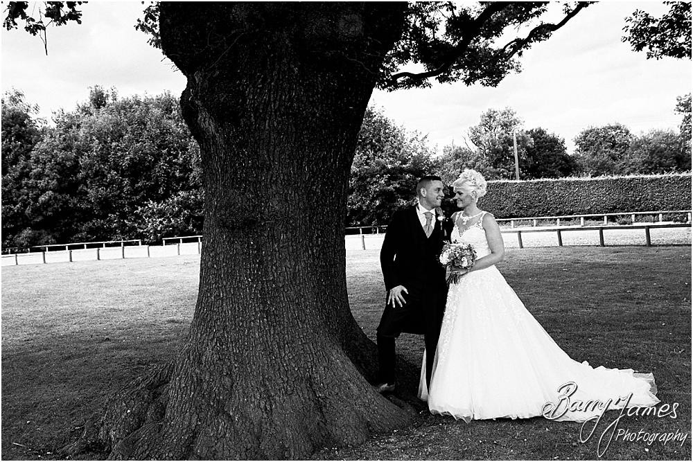Utilising the countryside setting of the rear gardens at Oak Farm Hotel in Cannock by Cannock Wedding Photographer Barry James