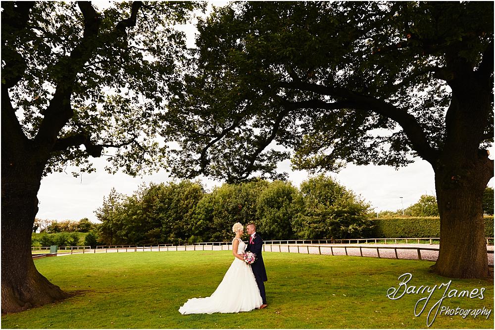 Utilising the countryside setting of the rear gardens at Oak Farm Hotel in Cannock by Cannock Wedding Photographer Barry James