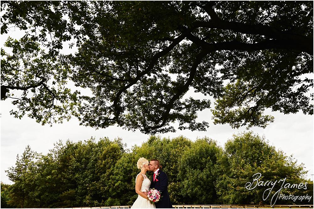 Utilising the countryside setting of the rear gardens at Oak Farm Hotel in Cannock by Cannock Wedding Photographer Barry James