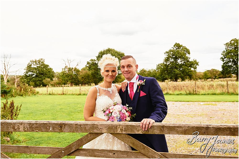 Utilising the countryside setting of the rear gardens at Oak Farm Hotel in Cannock by Cannock Wedding Photographer Barry James