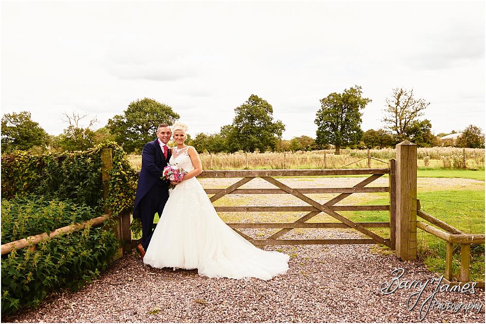Utilising the countryside setting of the rear gardens at Oak Farm Hotel in Cannock by Cannock Wedding Photographer Barry James