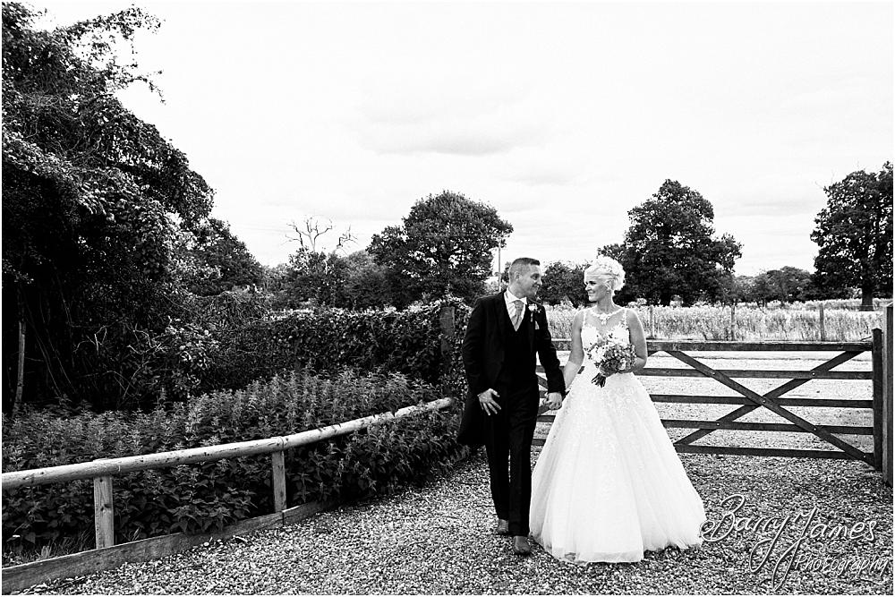 Utilising the countryside setting of the rear gardens at Oak Farm Hotel in Cannock by Cannock Wedding Photographer Barry James
