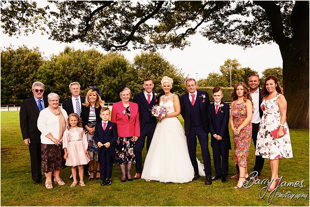 Relaxed family photographs in the gardens at Oak Farm Hotel in Cannock by Cannock Wedding Photographer Barry James