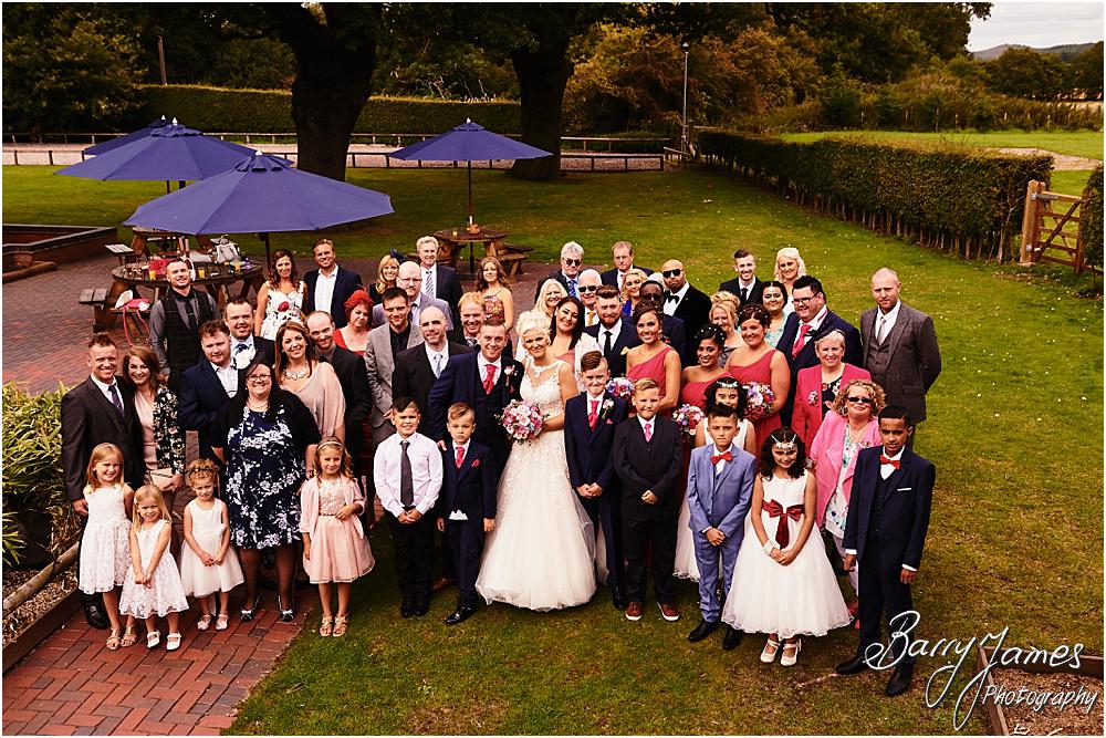 Relaxed family photographs in the gardens at Oak Farm Hotel in Cannock by Cannock Wedding Photographer Barry James