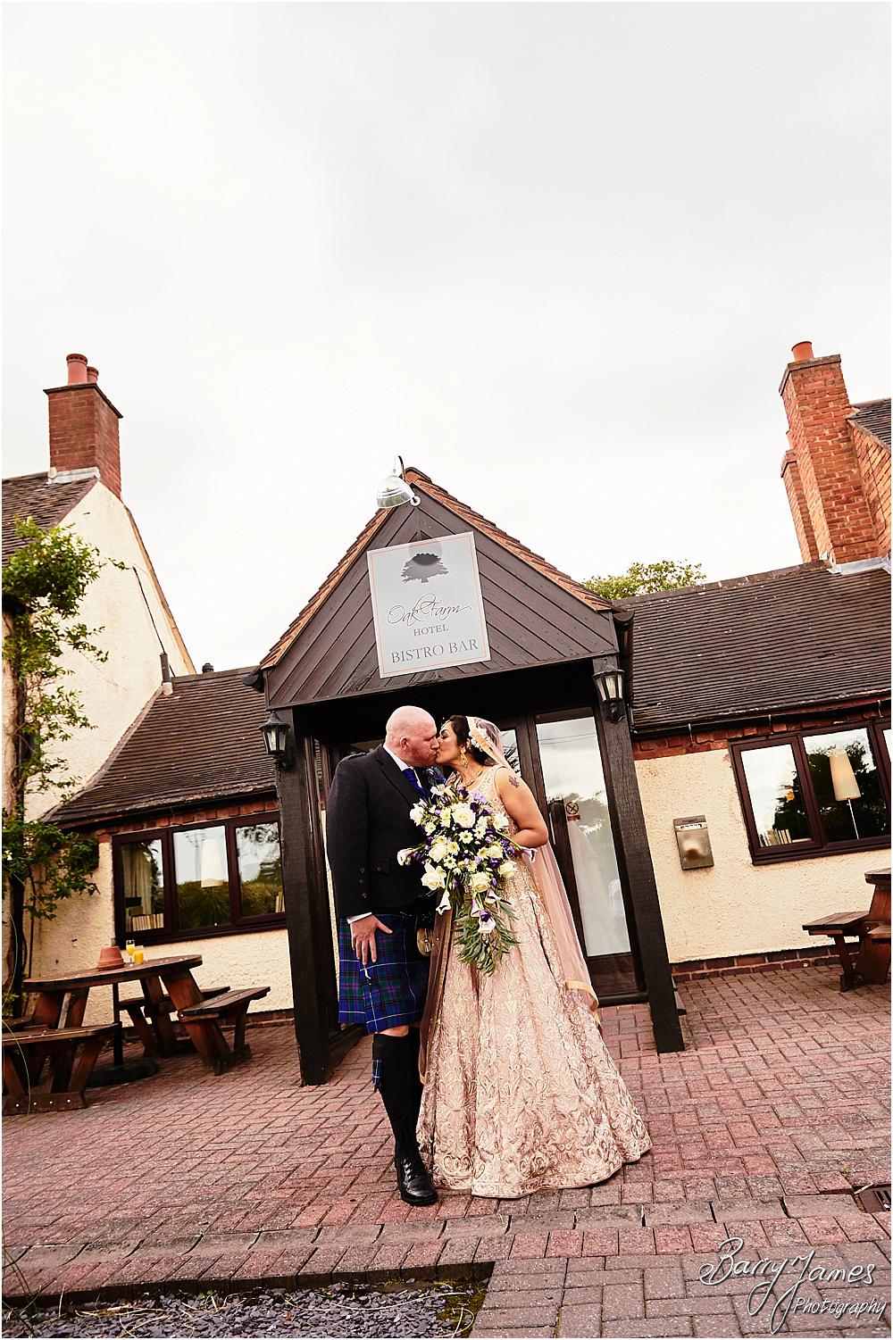Creative portraits of the bride and groom in the stunning front gardens at Oak Farm Hotel in Cannock by Cannock Wedding Photographer Barry James