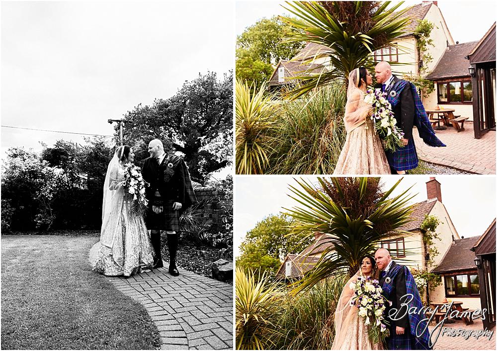 Creative portraits of the bride and groom in the stunning front gardens at Oak Farm Hotel in Cannock by Cannock Wedding Photographer Barry James