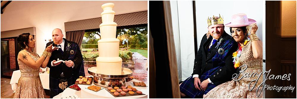 Cake cutting fun for the bride and groom at Oak Farm Hotel in Cannock by Cannock Wedding Photographer Barry James