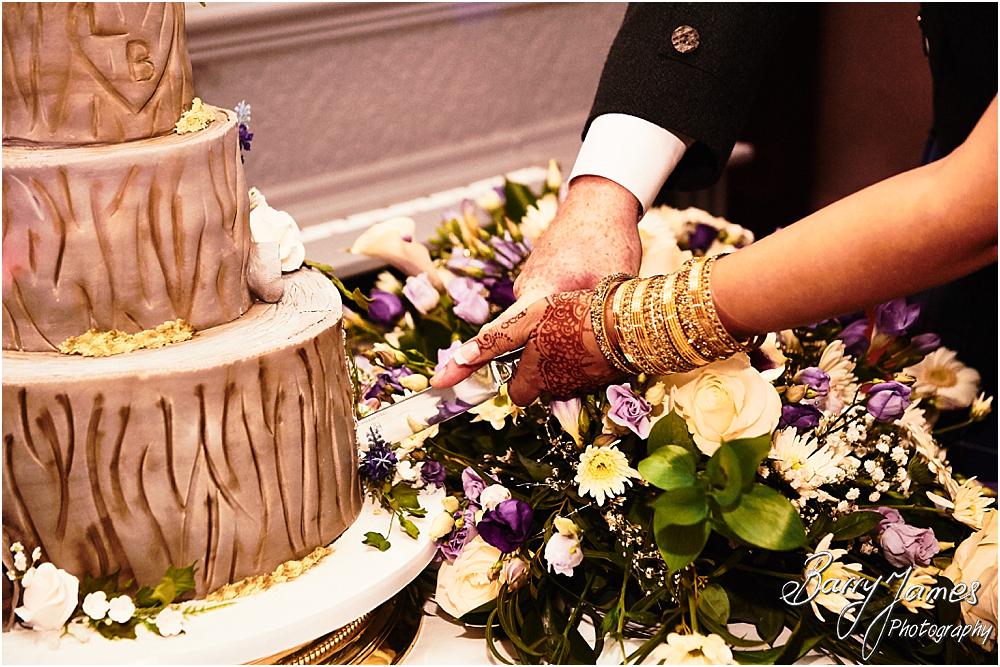 Cake cutting fun for the bride and groom at Oak Farm Hotel in Cannock by Cannock Wedding Photographer Barry James