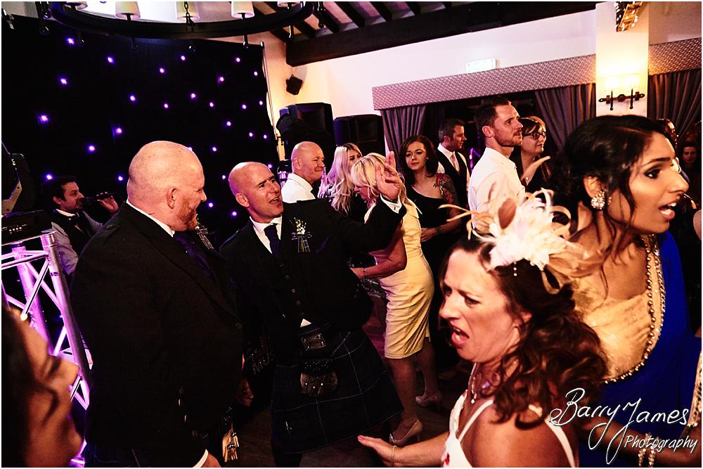 Creative photographs showing the life and wonderful feeling of the wedding reception as the party got truly underway at Oak Farm Hotel in Cannock by Cannock Wedding Photographer Barry James